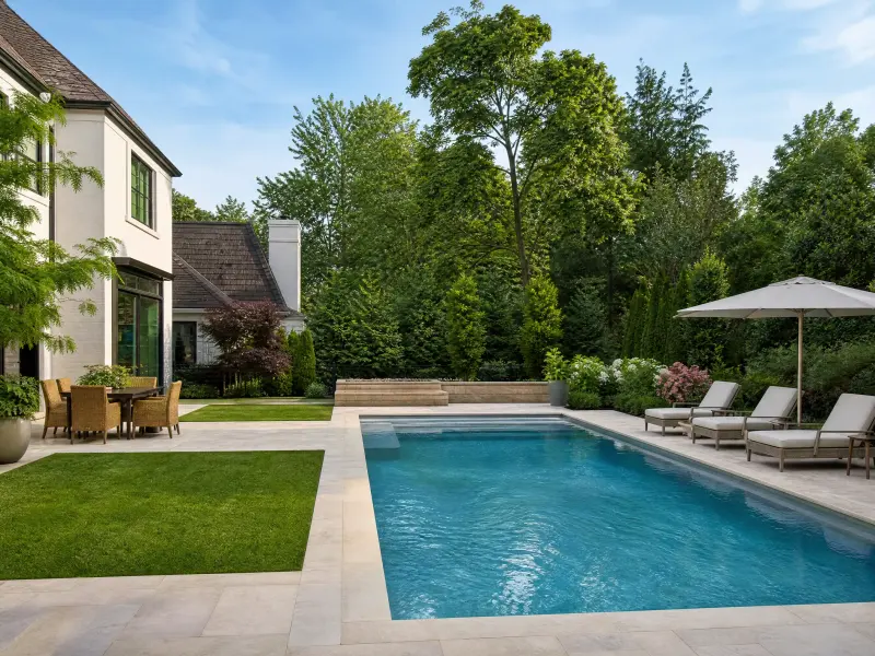 Backyard design with pool, seating, and planting